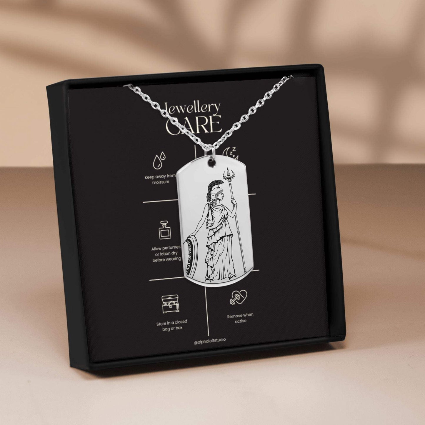Athena silver mythology necklace in packaging showing front and back engraved designs
