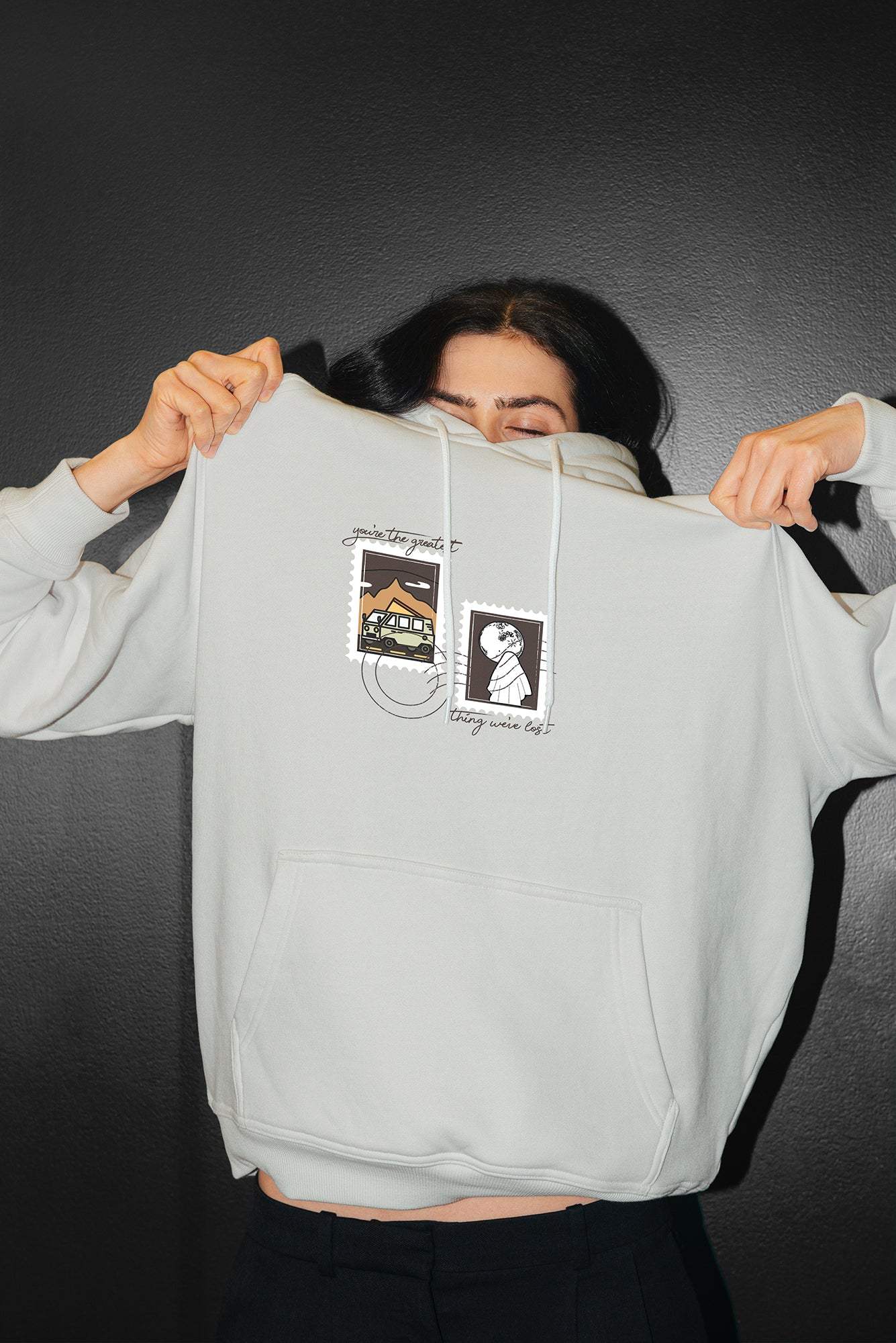 Model wearing grey embroidered hoodie - you're gonna go far inspired hoodie - noah kahan tour outfit ideas