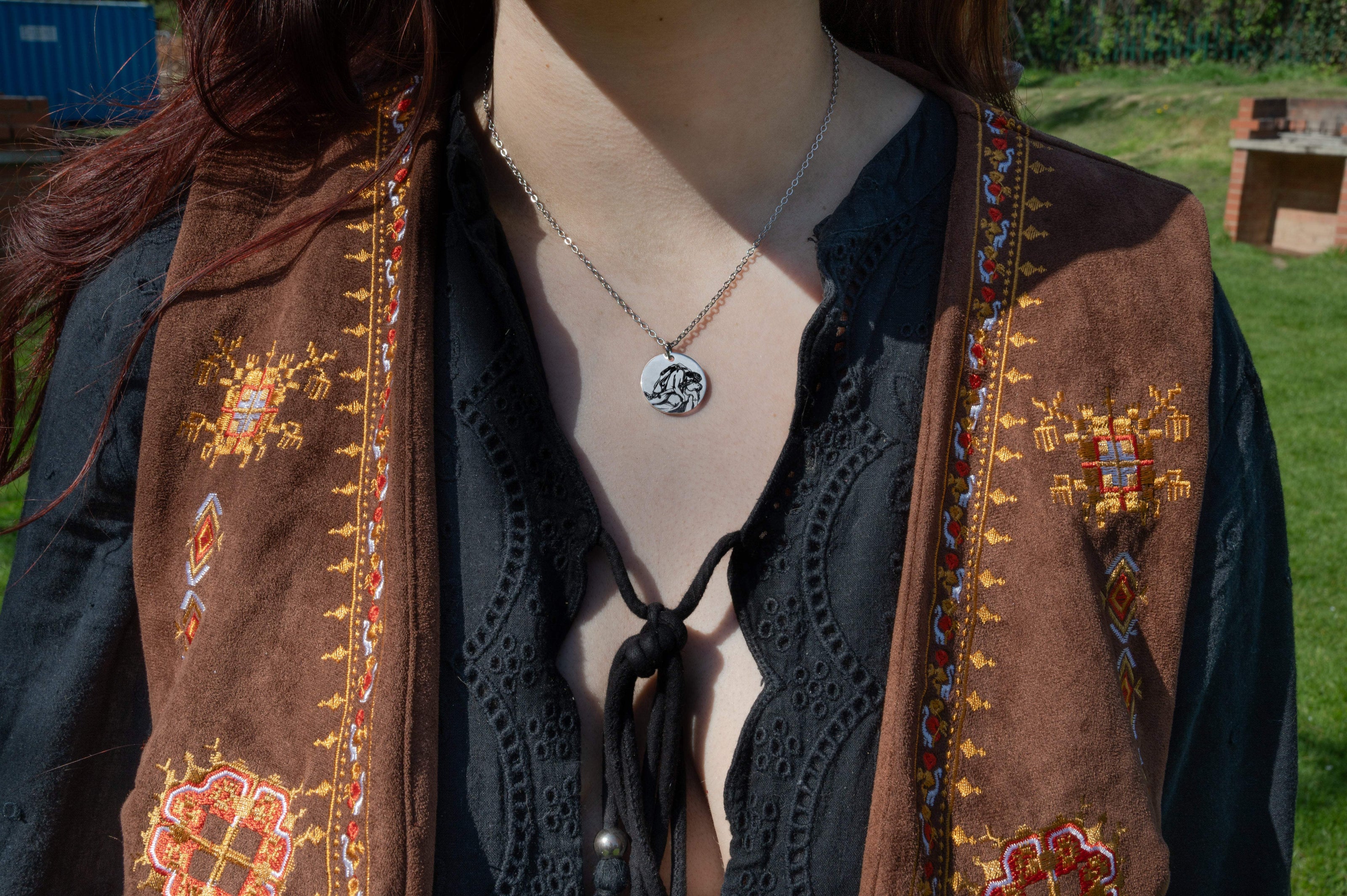 Model wearing ancient greek jewellery Orpheus and Eurydice necklace in silver.