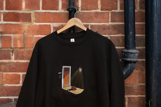Porch Light embroidered sweatshirt inspired by Noah Kahan Porch Light - Noah Kahan tour outfit - embroidery front view on hanger 