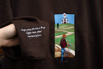 Sleeve detail closeup of The Great Divide stained glass design t-shirt in brown - noah kahan concert outfit 